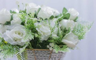 Flower bouquet on white background. Bunch of roses flowers, petal of white roses. Decor for party, holiday concept.